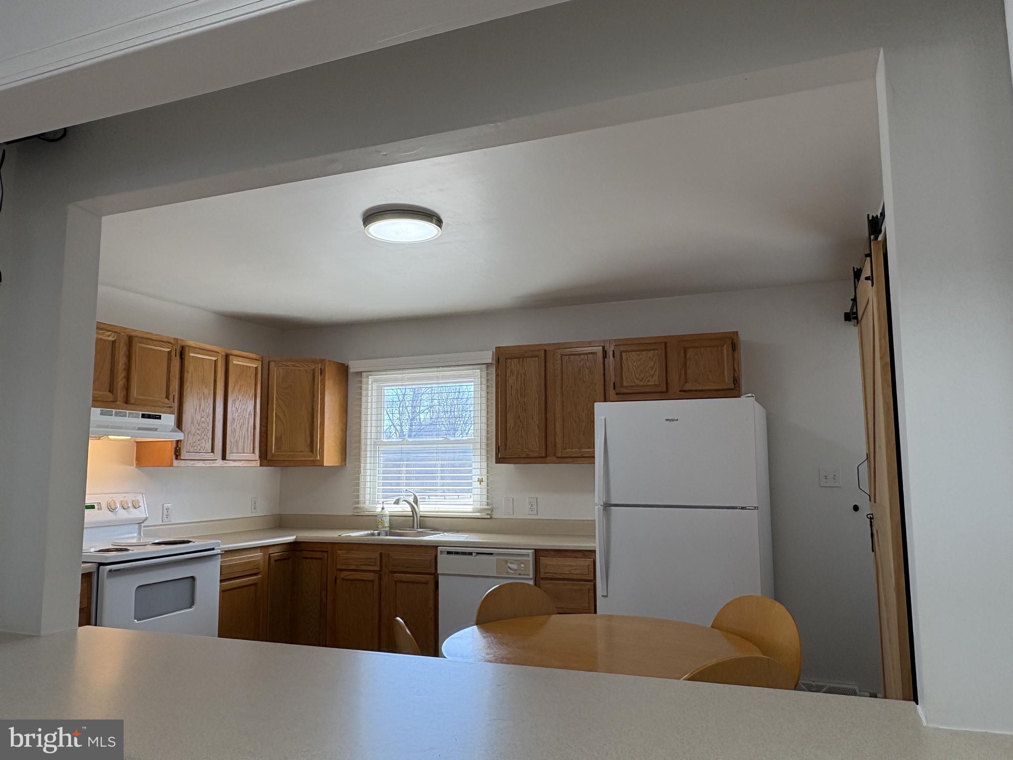 2306 Porter Road Bear, DE 19701 - Photo 27 of 48 Kitchen View from Hall through Window