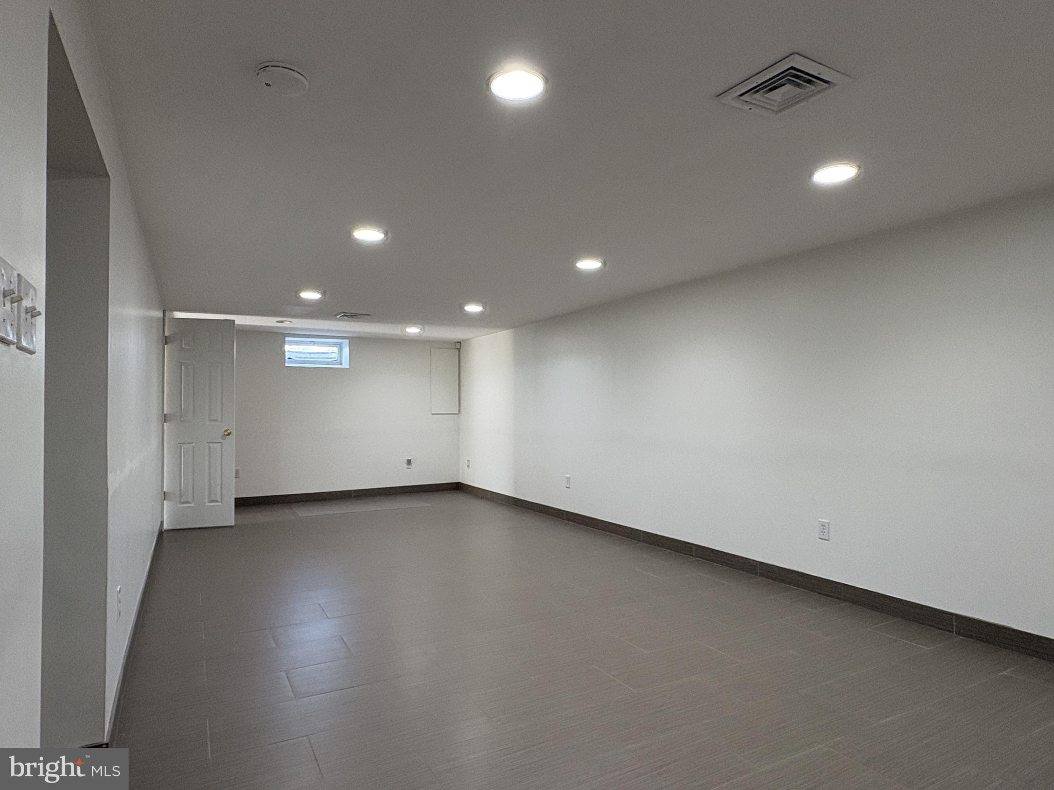 2306 Porter Road Bear, DE 19701 - Photo 28 of 48 Large Finished Basement w/ Ceramic Tile Floor