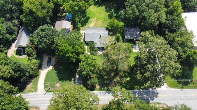 6538 North Sweetwater Road Lithia Springs, GA 30122 - Photo 15 of 16 an aerial view of a house with a yard and large trees
