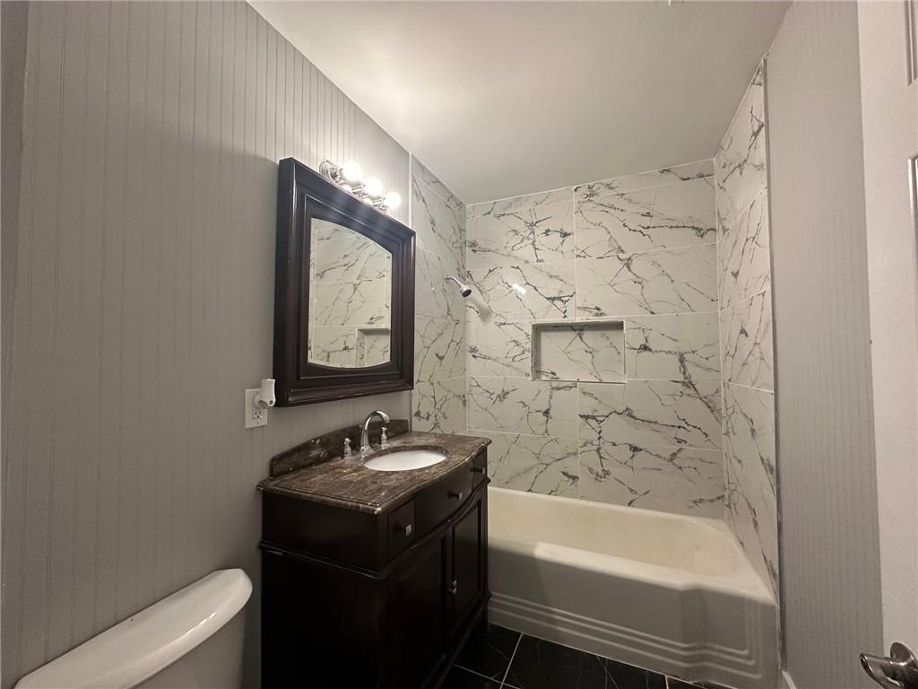 6538 North Sweetwater Road Lithia Springs, GA 30122 - Photo 9 of 16 a bathroom with a sink a toilet and bathtub