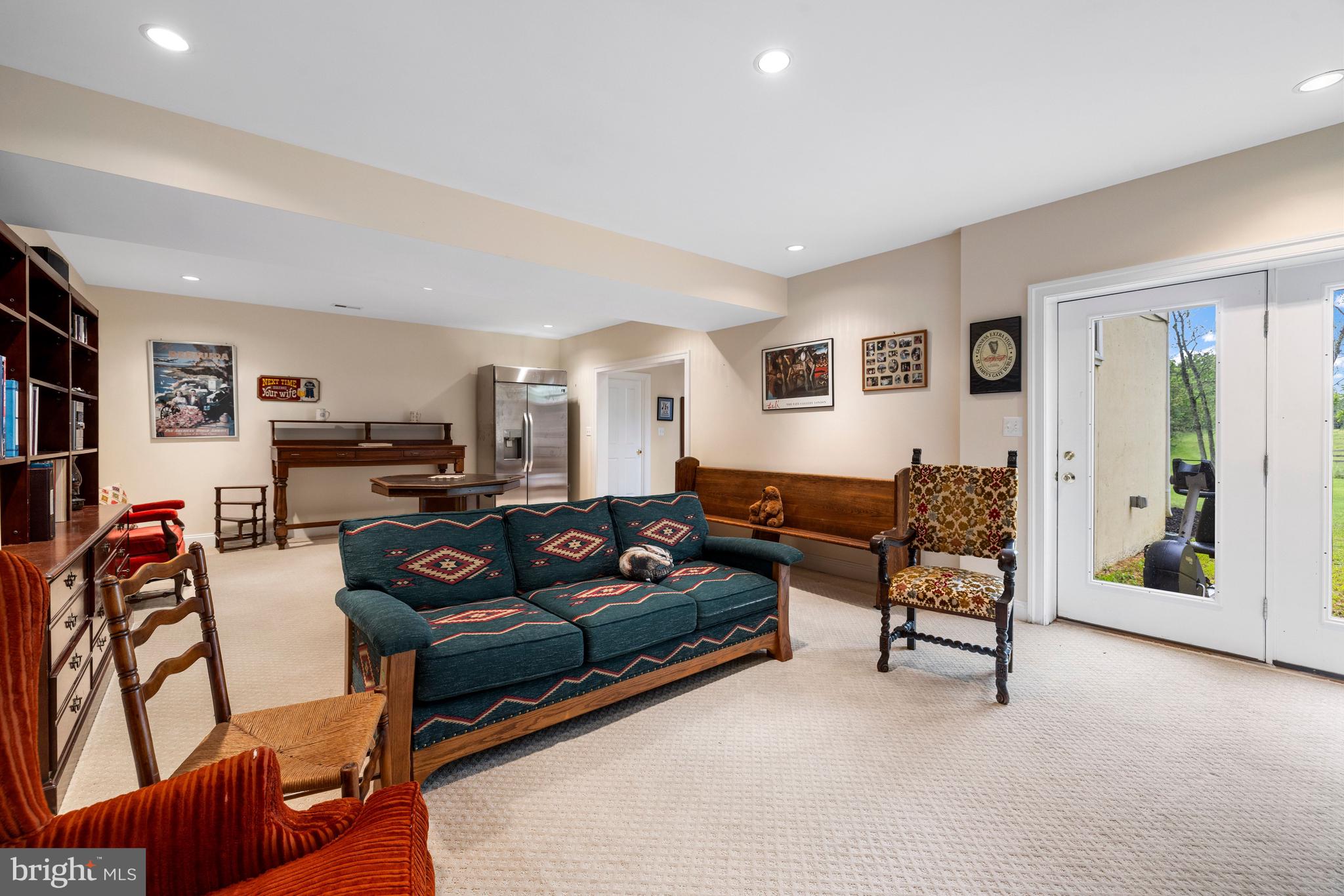 20147 Woodtrail Road Round Hill, VA 20141 - Photo 36 of 41 a living room with furniture and a flat screen tv