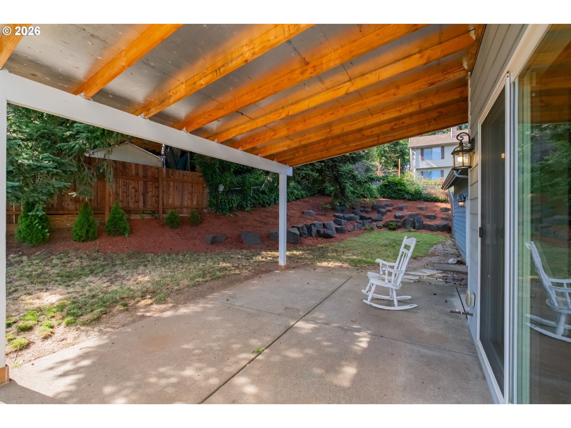 2925 Doaks Ferry Road Northwest Salem, OR 97304 - Photo 44 of 47 a view of a backyard with table and chairs with wooden fence