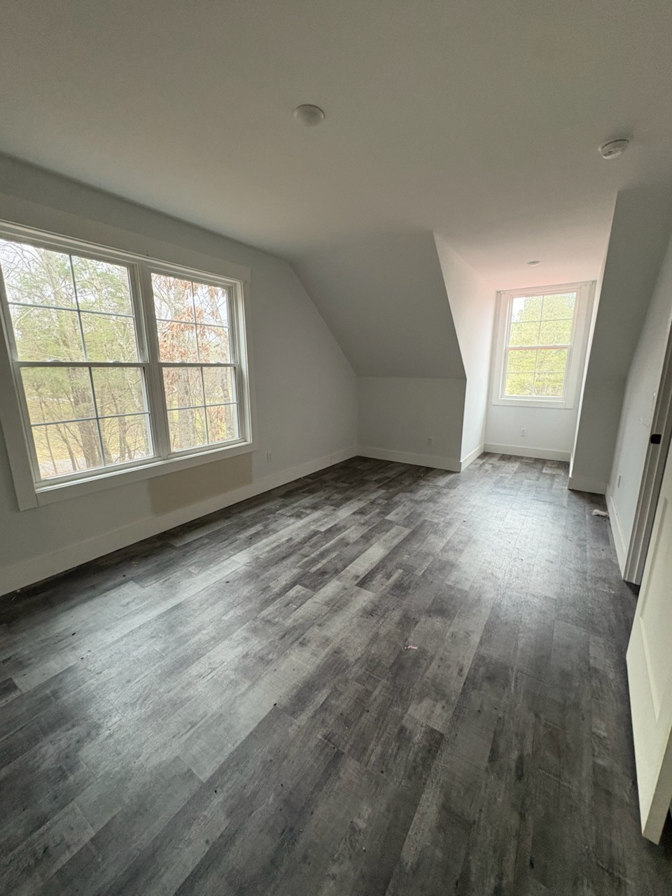 422 Parker Road Portland, TN 37148 - Photo 18 of 21 wooden floor in an empty room with a window
