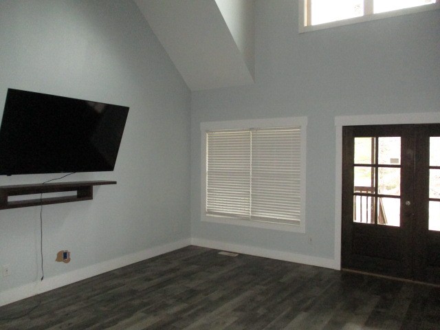 422 Parker Road Portland, TN 37148 - Photo 7 of 21 an empty room with wooden floor and windows