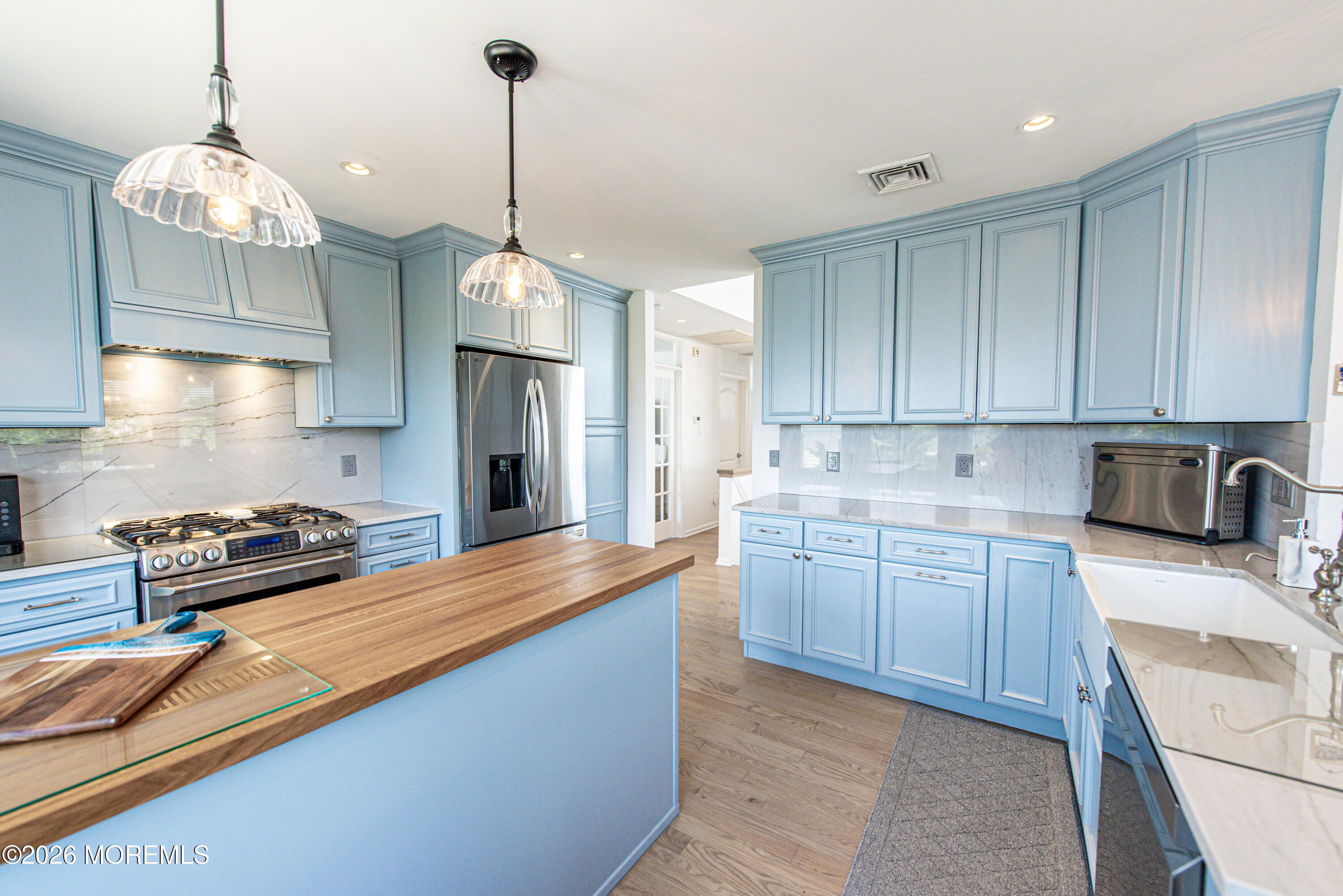5 A Sunset Boulevard Barnegat Light, NJ 08006 - Photo 12 of 65 a kitchen with stainless steel appliances granite countertop a sink a stove and a wooden floors