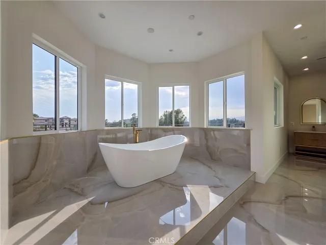 a bathroom with a double vanity sink a mirror and a shower