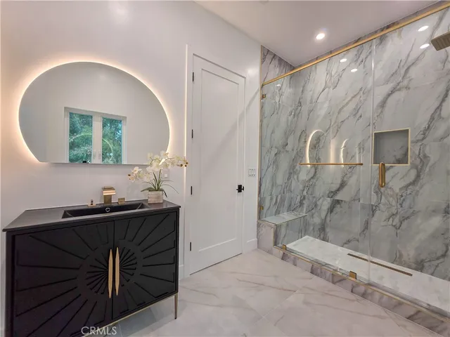 a room with a sink and a mirror