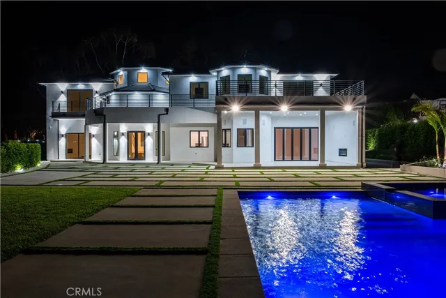 a swimming pool view with a outdoor seating space
