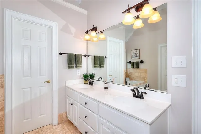a bathroom with a sink vanity and a mirror