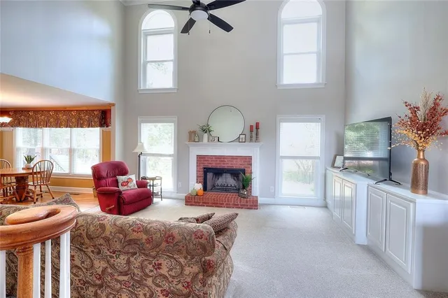 a bedroom with furniture fireplace and window