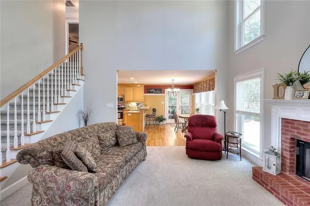 a living room with furniture fireplace and a fireplace