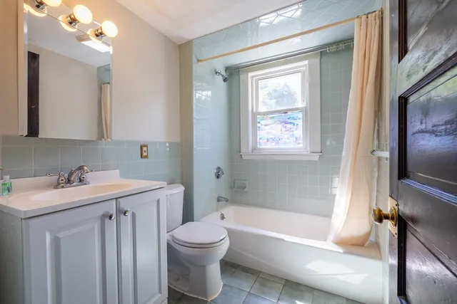 a bathroom with a sink toilet and bathtub