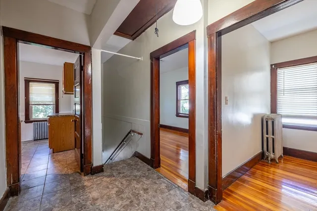 a view of a kitchen with a refrigerator a sink and dishwasher next to a window