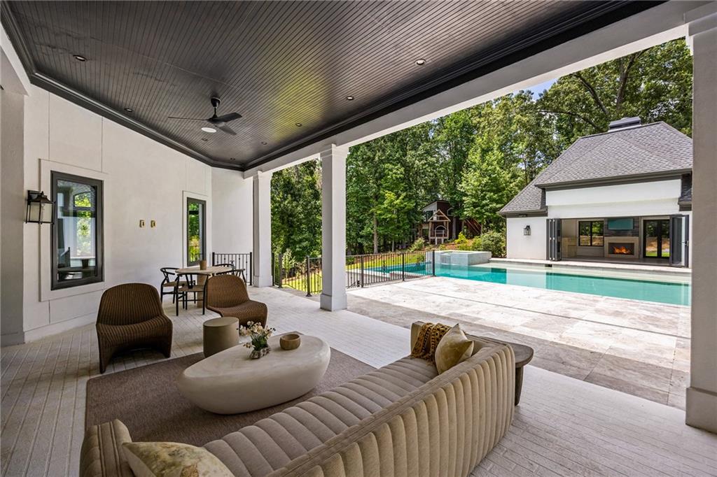 5320 Riverview Road Northwest Atlanta, GA 30339 - Photo 69 of 83 a living room with furniture and a floor to ceiling window