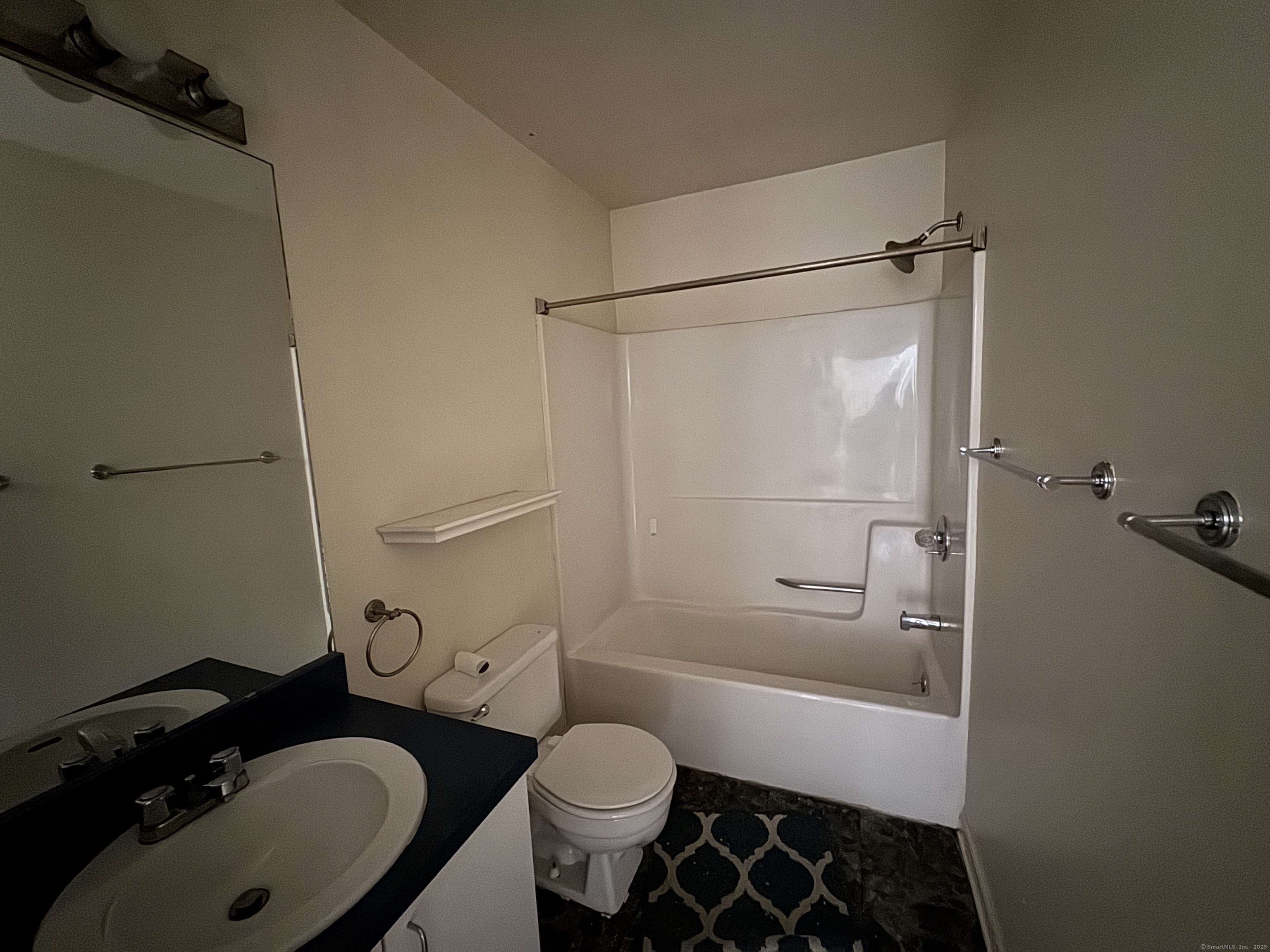 117 Hamden Avenue, Unit F Waterbury, CT 06704 - Photo 7 of 8 a bathroom with a sink toilet and shower