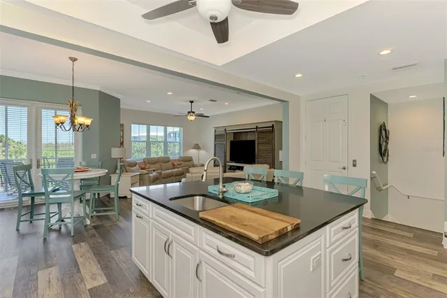 a view of a chairs and table in the balcony