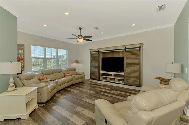 a bathroom with a granite countertop sink a toilet and shower