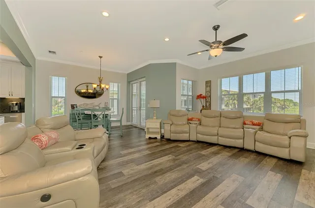 a view of a chair and tables in the balcony
