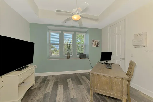 a bathroom with a granite countertop sink mirror and shower
