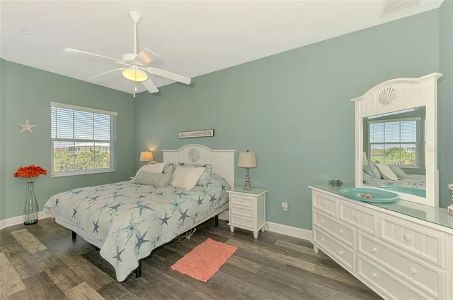 a view of a house with a big yard and potted plants