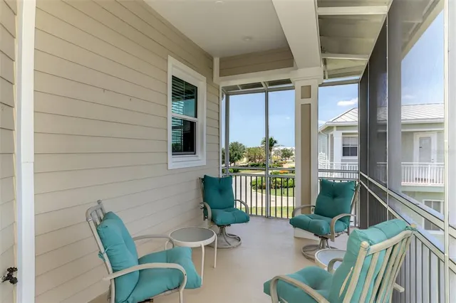 a view of a patio with a table and chairs
