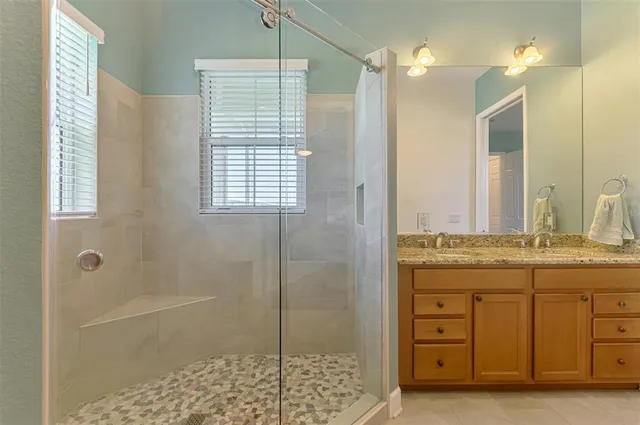 an aerial view of residential houses with outdoor space and swimming pool