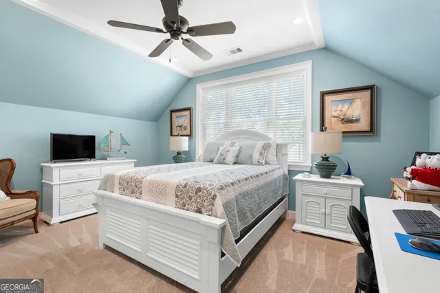 a bedroom with a bed and a couch