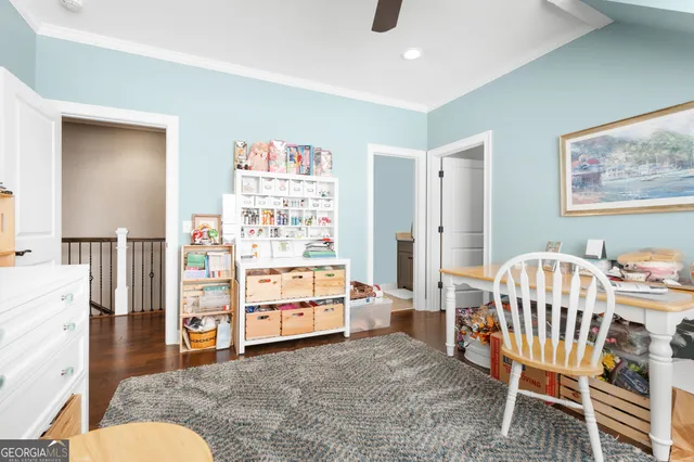 a bedroom with furniture and baby crib