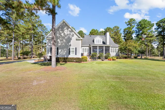 a front view of a building with a garden