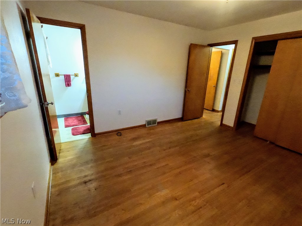 2586 Batdorf Road Wooster, OH 44691 - Photo 15 of 33 Unfurnished bedroom with hardwood / wood-style floors and a closet