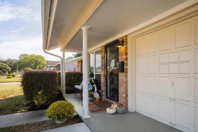 a view of a couches under an umbrella