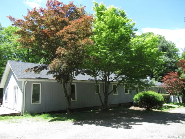 a house with trees in front of it