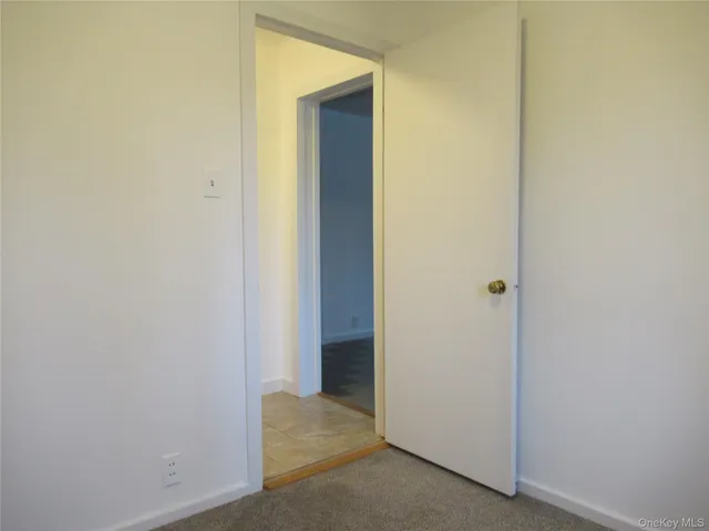 a view of a hallway with closet