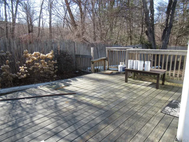 a view of a chair and table on the wooden floor