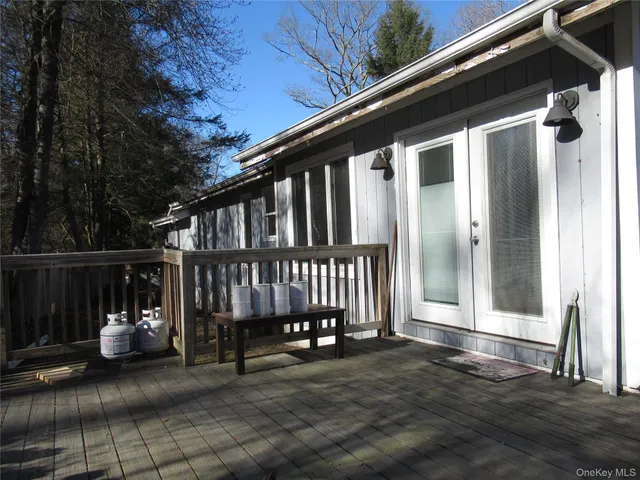 a view of porch with a bench