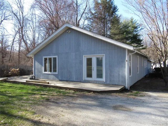 a house that has a big yard with large trees
