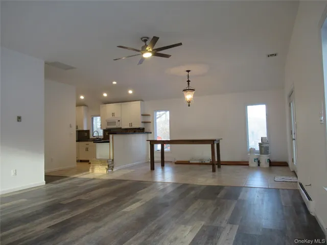 a view of a kitchen with a sink and a window