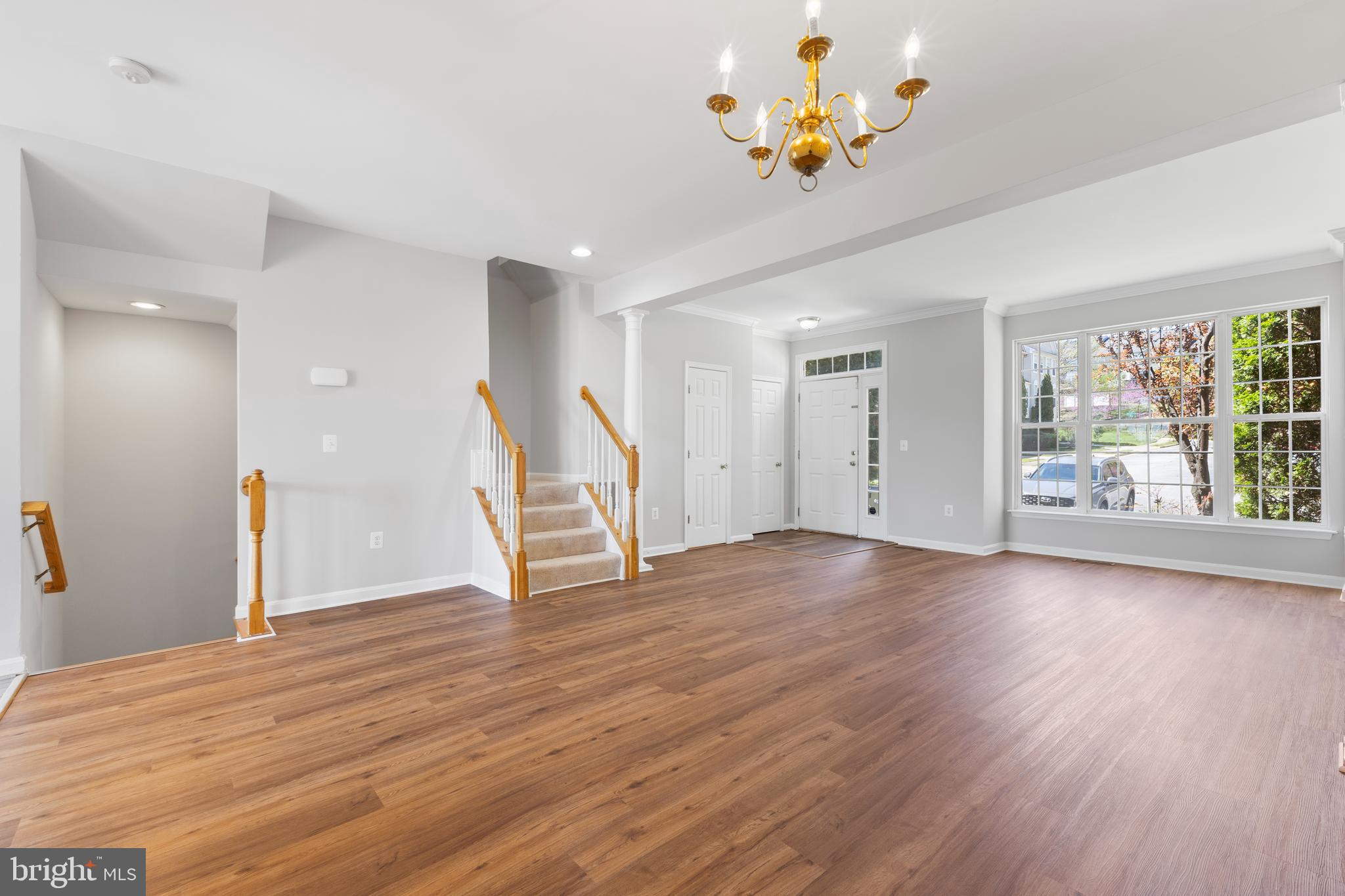 2925 Rotterdam Loop Woodbridge, VA 22191 - Photo 11 of 55 a view of an empty room with a window and wooden floor
