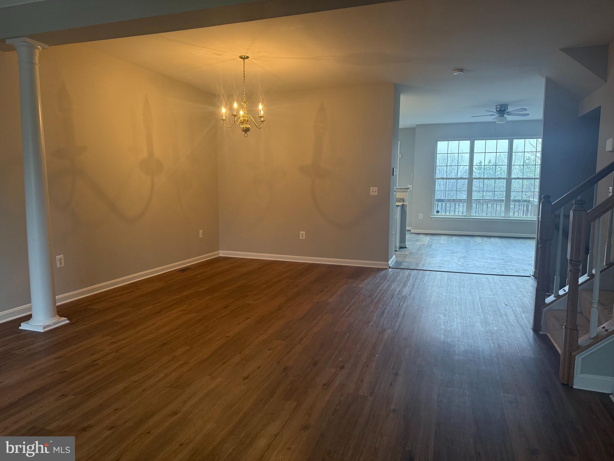 2925 Rotterdam Loop Woodbridge, VA 22191 - Photo 12 of 55 wooden floor in an empty room with a window