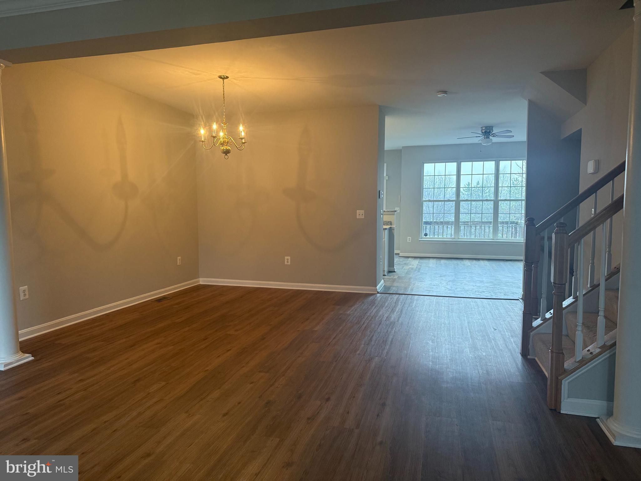 2925 Rotterdam Loop Woodbridge, VA 22191 - Photo 14 of 55 wooden floor in an empty room with a window