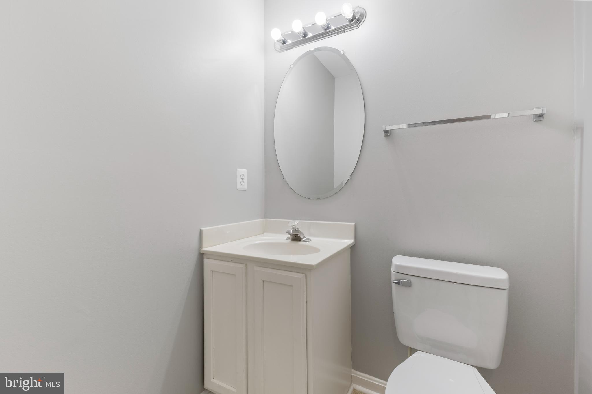 2925 Rotterdam Loop Woodbridge, VA 22191 - Photo 35 of 55 a bathroom with a toilet sink and mirror