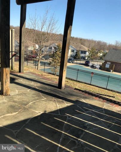 2925 Rotterdam Loop Woodbridge, VA 22191 - Photo 44 of 55 a view of a balcony with floor to ceiling windows with wooden floor