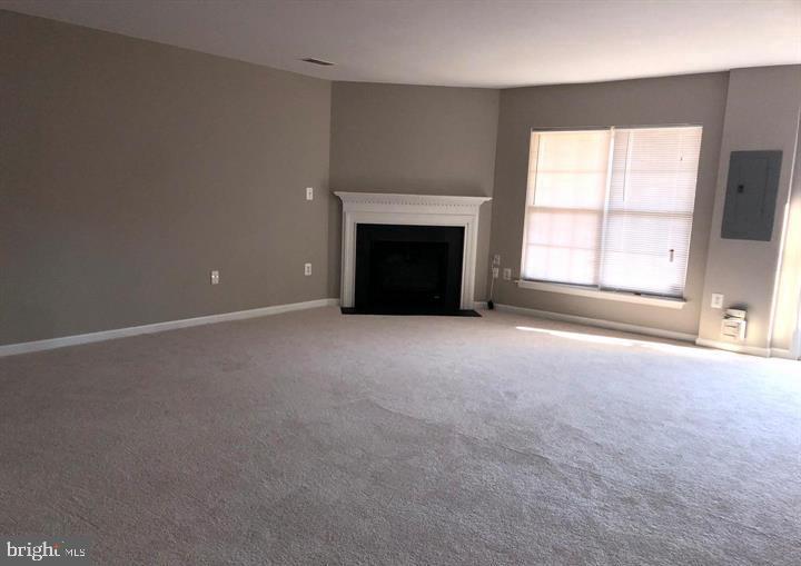 2925 Rotterdam Loop Woodbridge, VA 22191 - Photo 53 of 55 an empty room with a fireplace