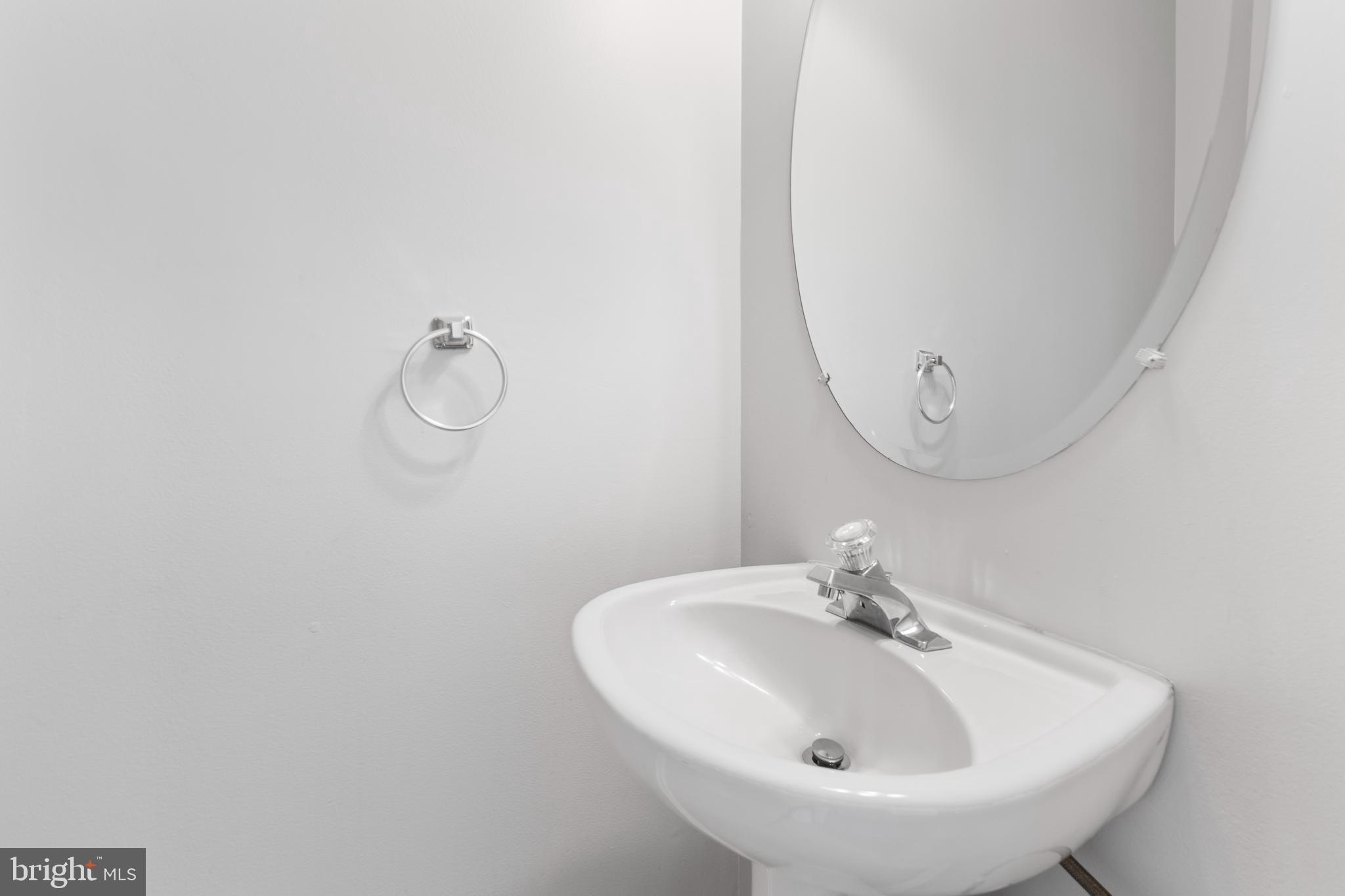 2925 Rotterdam Loop Woodbridge, VA 22191 - Photo 7 of 55 a bathroom with a sink and mirror
