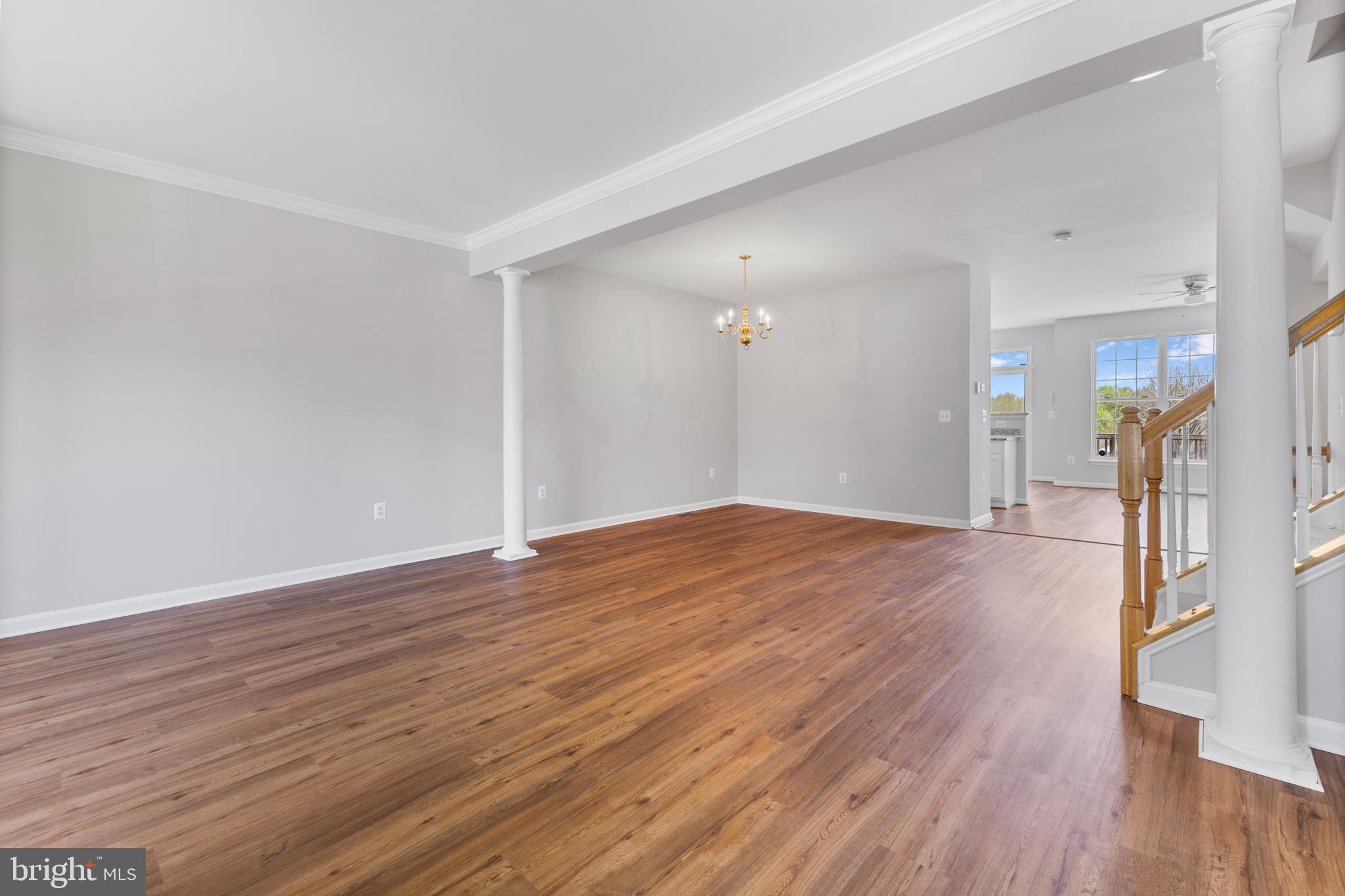 2925 Rotterdam Loop Woodbridge, VA 22191 - Photo 9 of 55 a view of a big room with wooden floor and a window