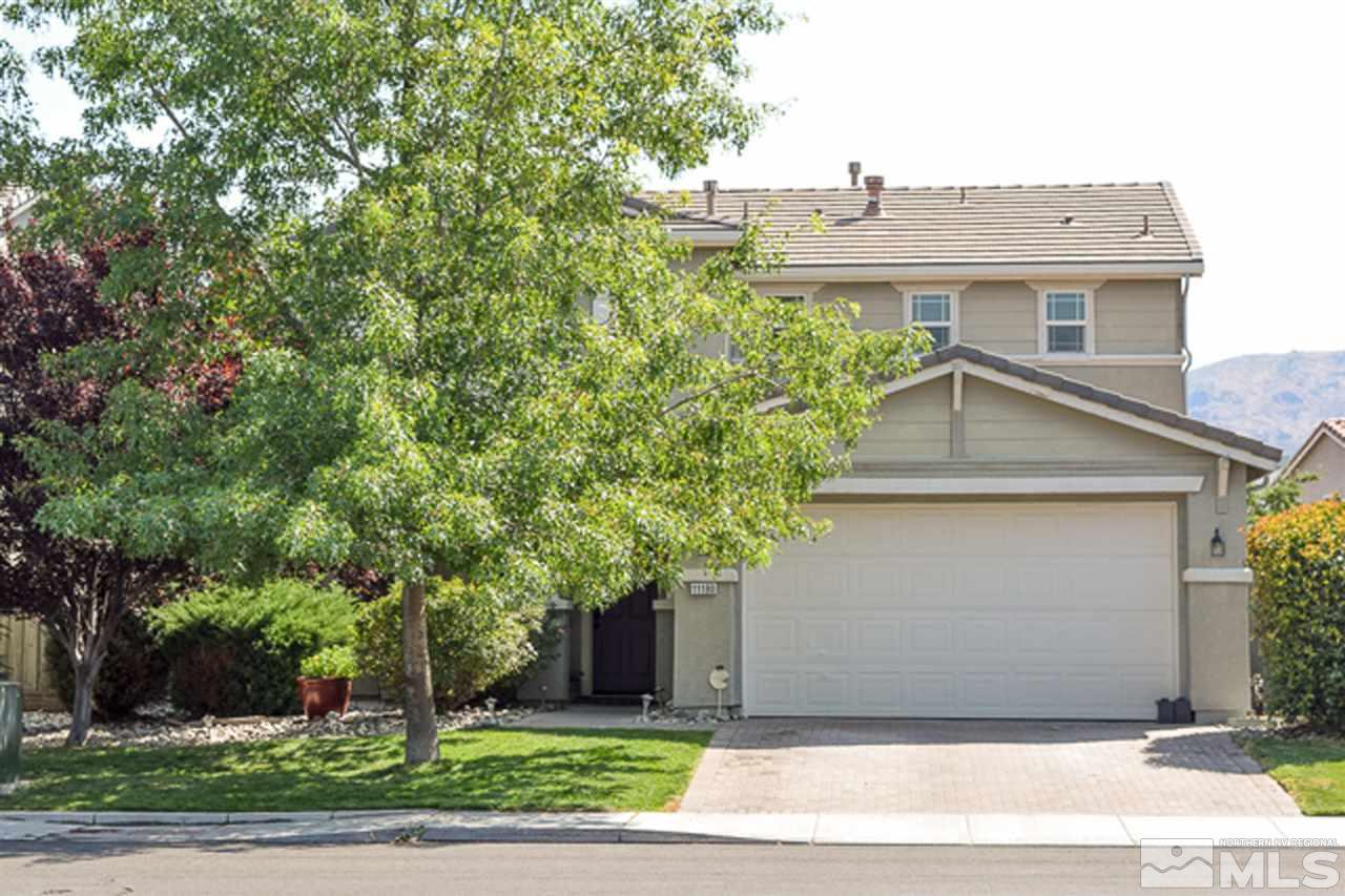 11180 Parma Way Reno, NV 89521 - Photo 1 of 37 a front view of a house with a yard and an trees