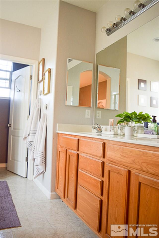 11180 Parma Way Reno, NV 89521 - Photo 18 of 37 a bathroom with a sink and a mirror