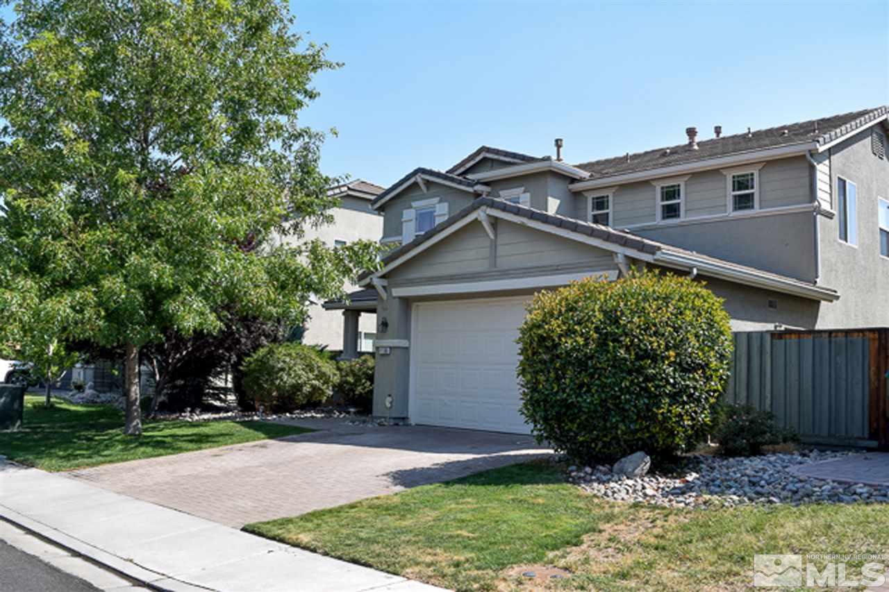 11180 Parma Way Reno, NV 89521 - Photo 2 of 37 a front view of a house with garden
