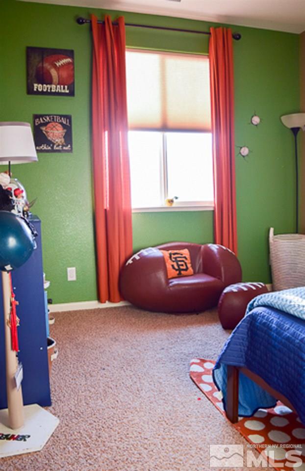 11180 Parma Way Reno, NV 89521 - Photo 25 of 37 a living room with furniture and a window