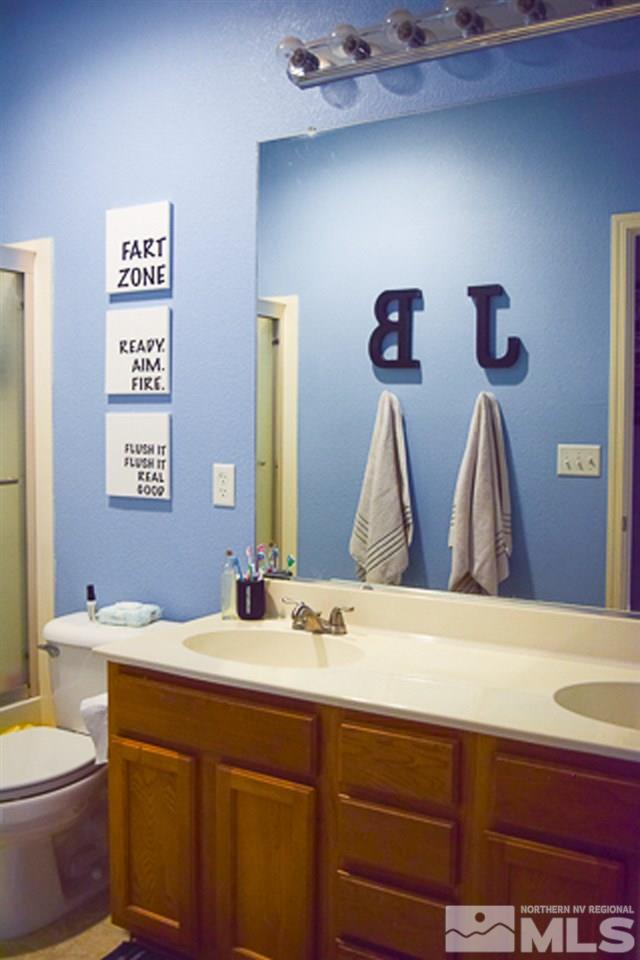 11180 Parma Way Reno, NV 89521 - Photo 26 of 37 a bathroom with a sink and a toilet